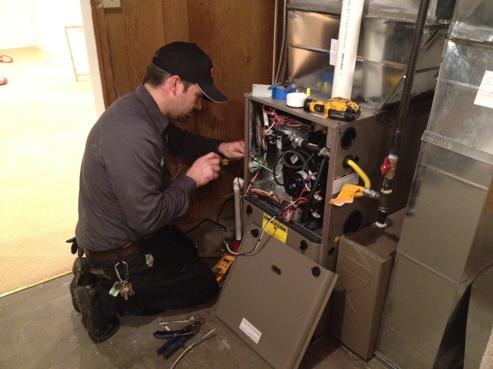 A furnace specialist checking the heating system